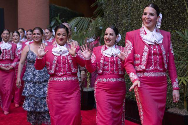Mariachi Reyna de Los Ángeles, the first all-women mariachi ensemble in the United States, walk the red carpet before an induction ceremony of the 19th class of California Hall of Fame inductees at the California Museum in Sacramento on Thursday.